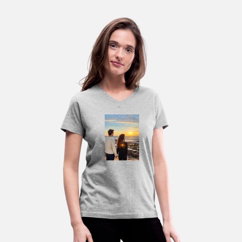 Couple Hand In Hand On Sandy Beach At Sunset